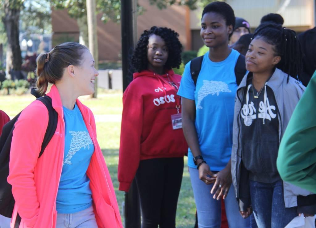 Sociology students with their school-age mentees during a campus tour