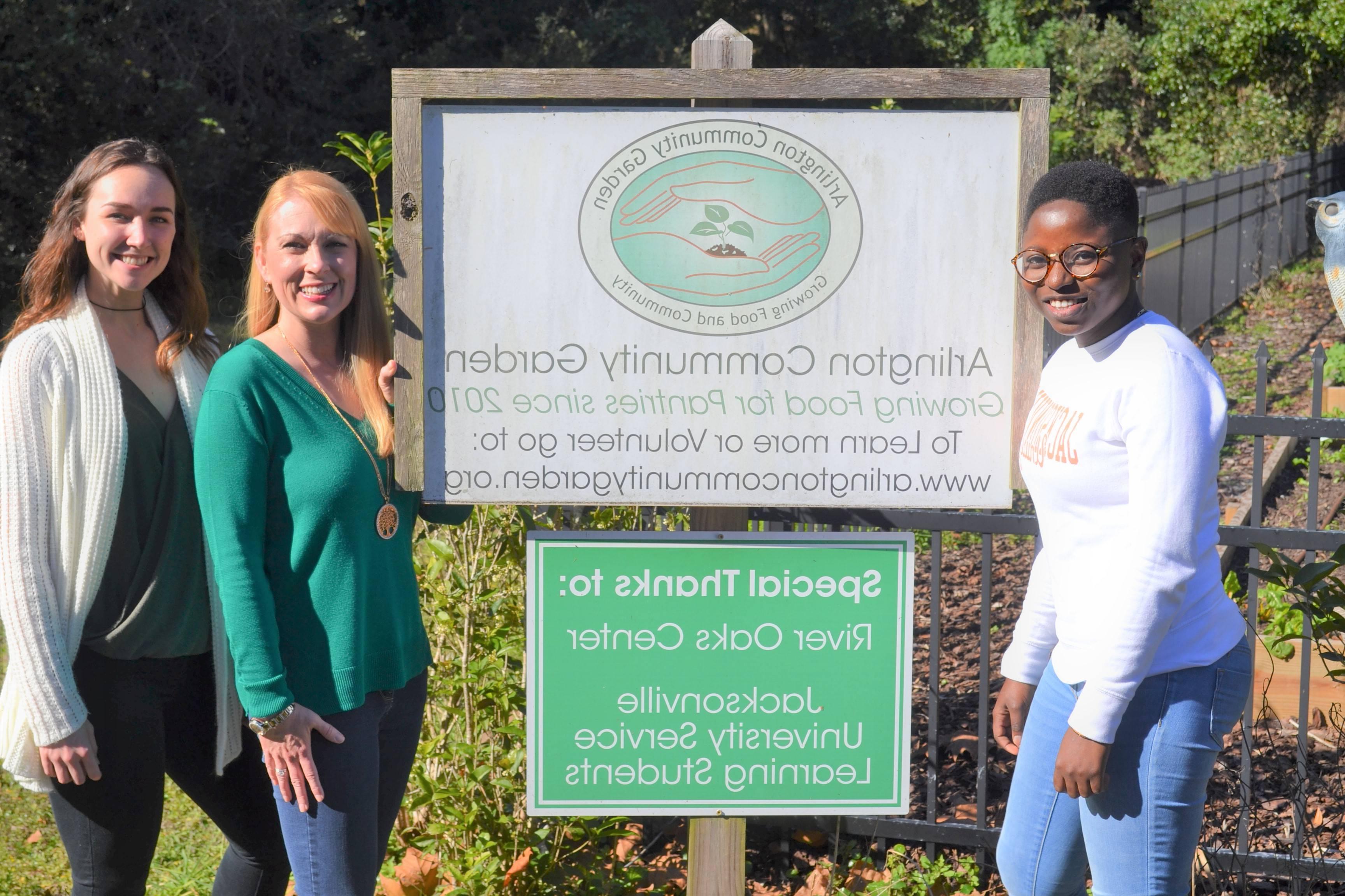 Students and Dr. Laura Atkins during a service-learning project at Arlington Community Garden